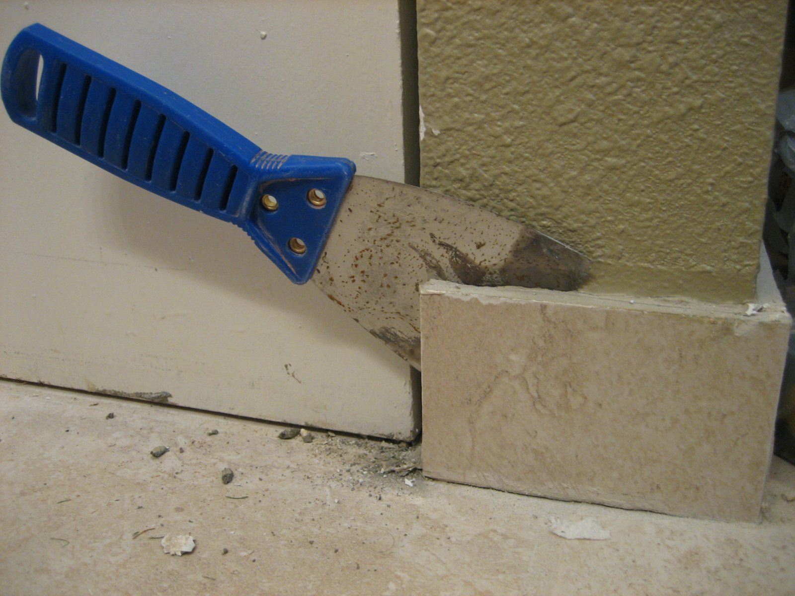 removing tiles using putty knife