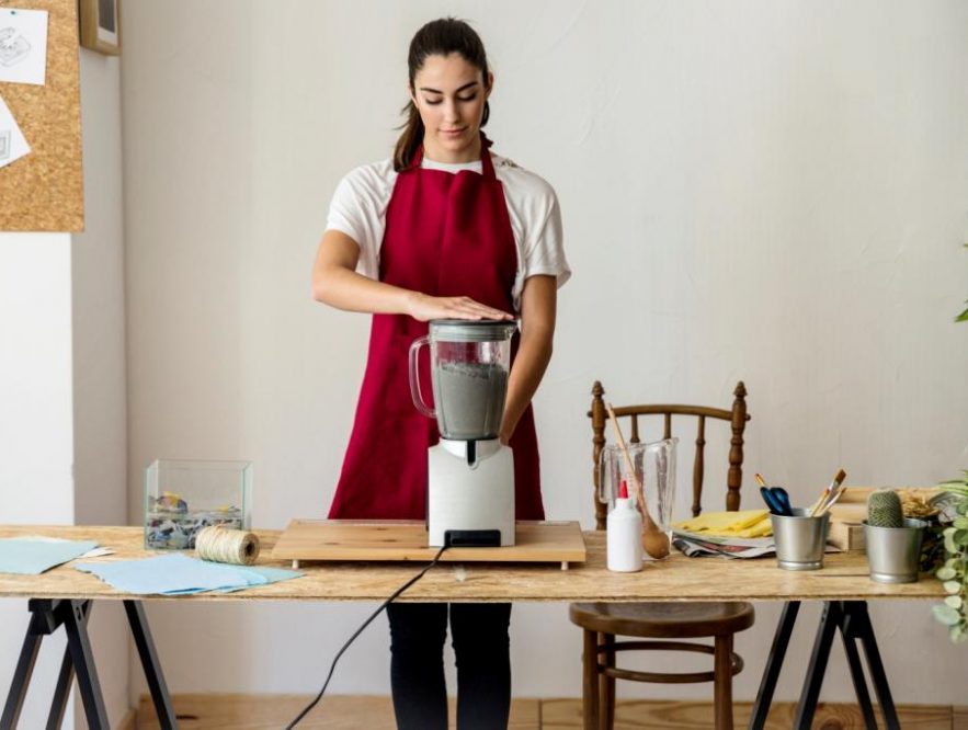 Women using a mixer grinder