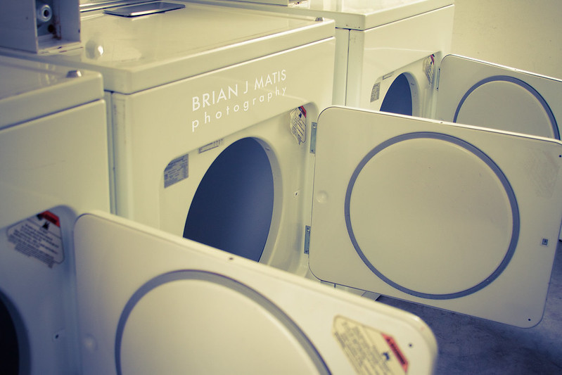 three clothes dryers